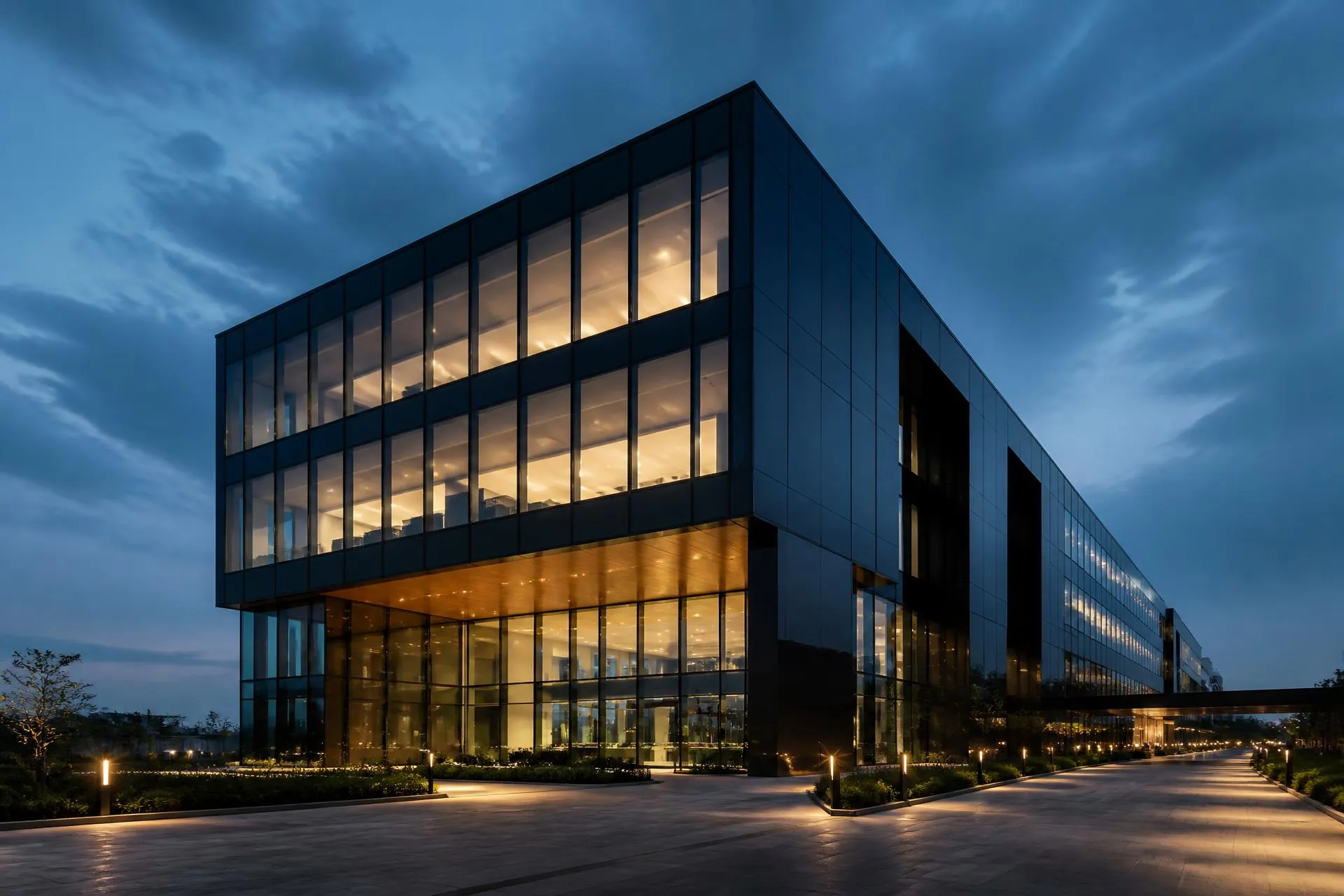 Modern glass office building at dusk representing Robishto's technology partnership for UK SMEs